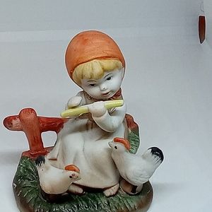 Hand painted Handgemalt Figurine of girl playing flute to chickens. 3 x 3 1/2